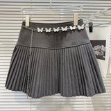 Solid Pleated Mini Skirt With Butterfly Chain- Outfit