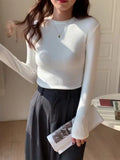 Women Wear A Long-Sleeved White T-Shirt With A Half-High Collar To Show A Thin Blouse In Autumn And