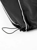 parachute trousers with cargo pockets and piping