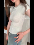 Black Round-Collar Short-Sleeved T-Shirt With A Black Round Neck Designed By European Designers Is A New Tight-Fitting, Skinny, Short-Style Blouse For Women In Spring And