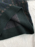 green knitted sweater with check